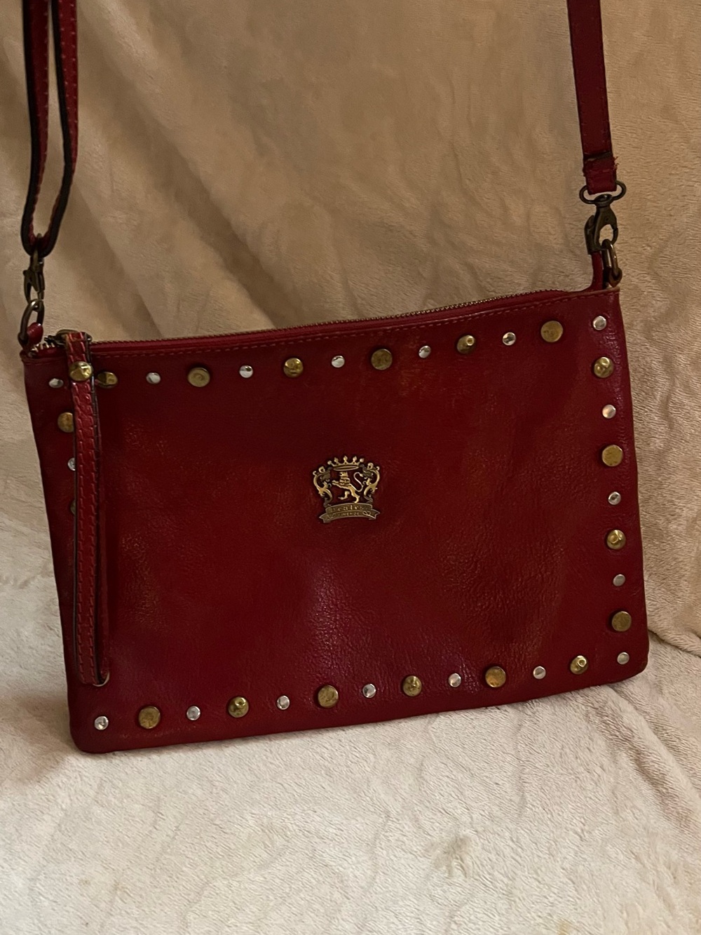 Classic Red Studded Leather Crossbody with Crest Accent